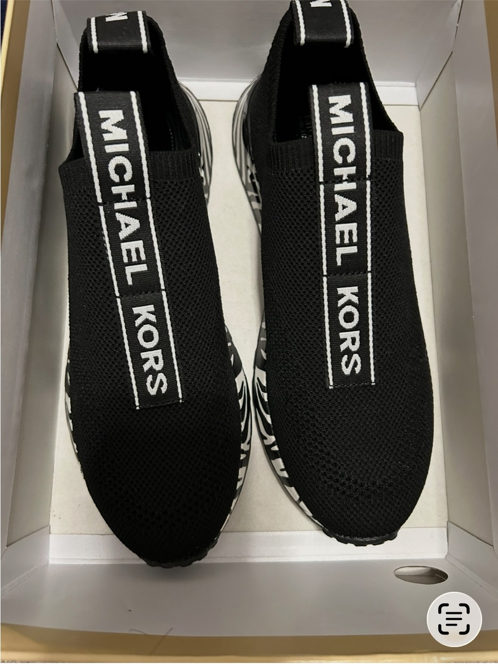 Michael Kors Black Knit Slip-On Sneakers with White Logo Tape and Graphic Sole